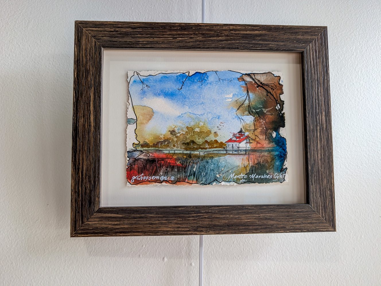 Watercolor of Manteo Marshes Light in a driftwood frame