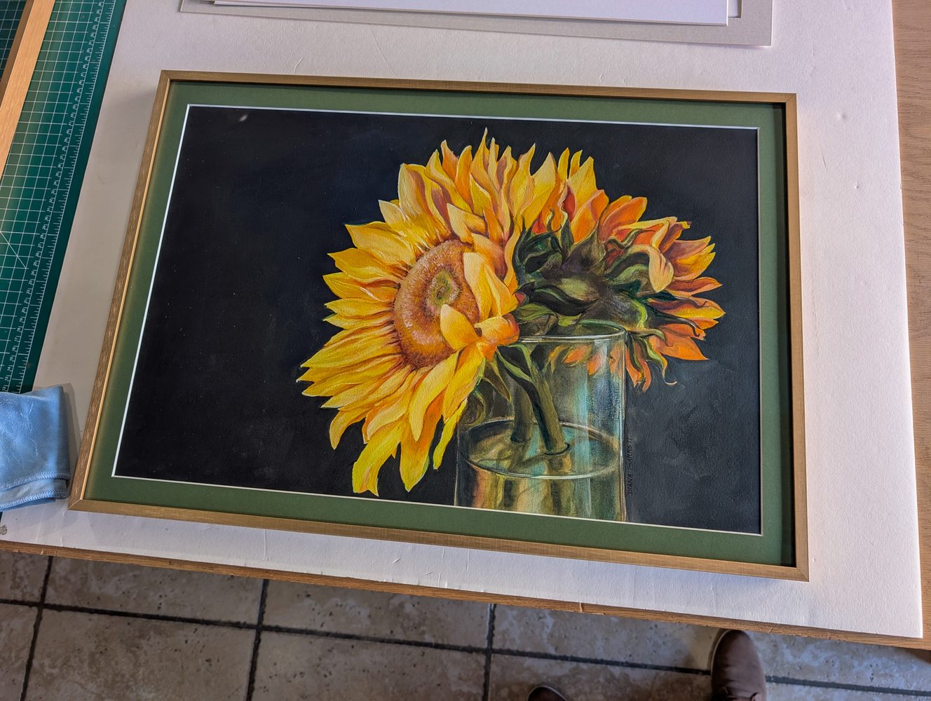 Sunflower watercolor in a gold frame with green mat