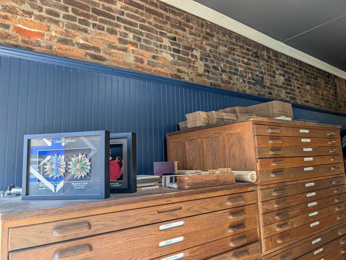 Flat file cabinets and framing samples at Sail Away