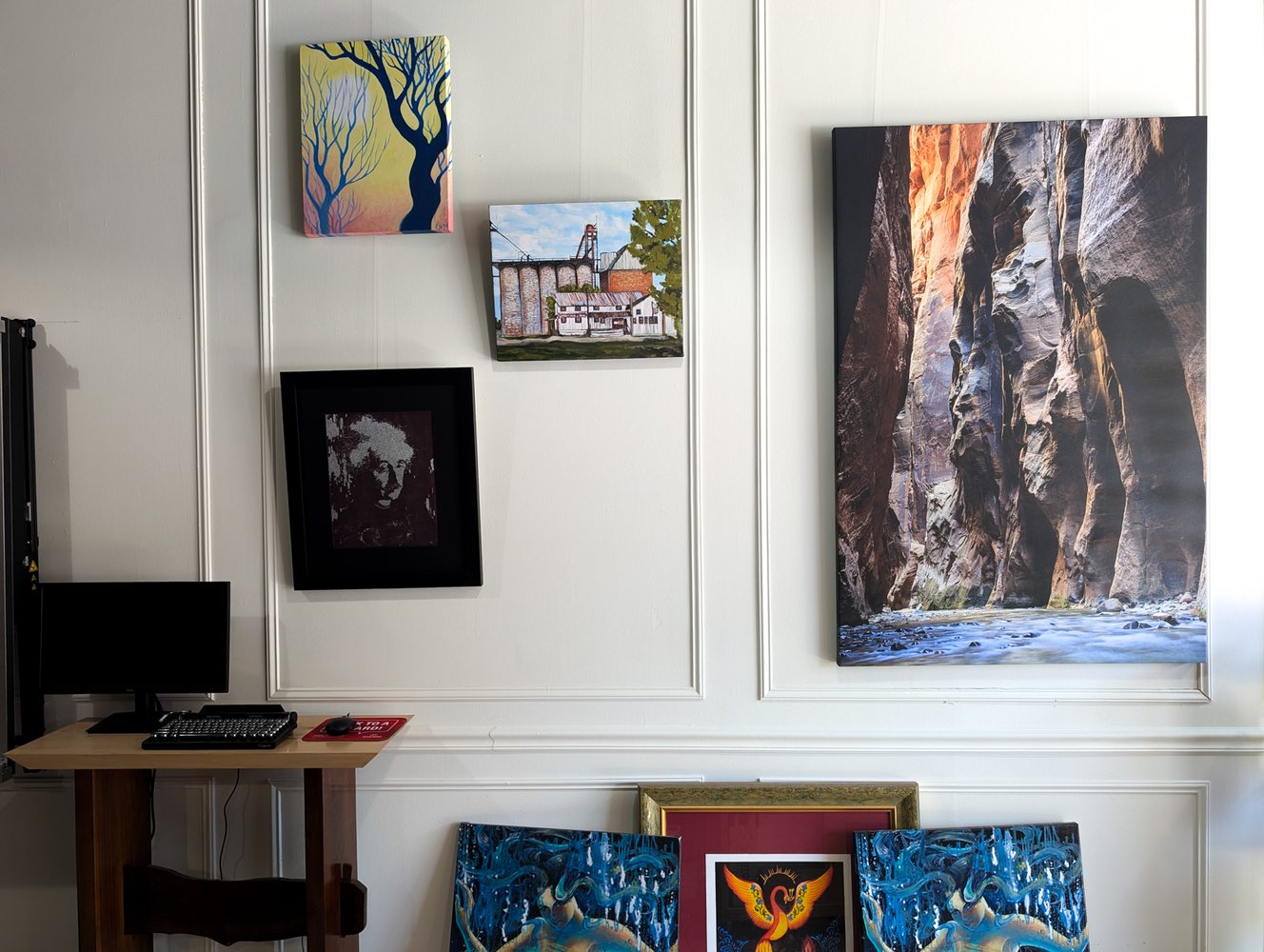Gallery wall at Sail Away with framed artwork and canvas prints